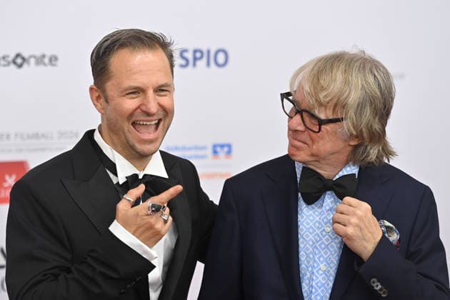 from left Philipp HOCHMAYR actor , Helge SCHNEIDER comedian,musician , 50 German Film Ball, Red Carpet, Red Carpet, on 24 01 2026 at the H o t e l B a y e r i s h o f, M u e n c h e n