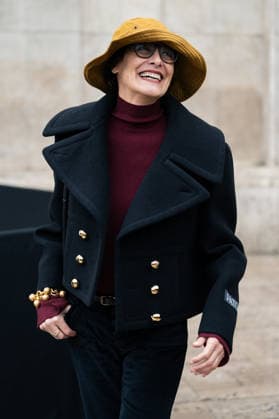 Patou - Outside Arrivals - Paris Fashion Week - Menswear Fall Winter 2026-2027 Ines de la Fressange wears red turtleneck sweater, black pants, black cropped coat, yellow bucket hat, outside Patou Menswear Fall Winter 2026-2027 show as part of Paris Fashion Week on January 25, 2026 in Paris, France., Credit:Lounis Tiar Avalon France, Paris  Copyright: xLounisxTiarx xAvalonx 1069344368