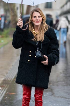 PFW - Patou Arrivals Anna Dello Russo wears black Patou fur short coat, red over the knees leather boots, black bag, gold chain necklace outside Patou Menswear Fall Winter 2026-2027 show as part of Paris Fashion Week on January 25, 2026 in Paris, France. Photo by LounisPhotography ABACAPRESS.COM Paris France  Copyright: xLounisPhotography ABACAx