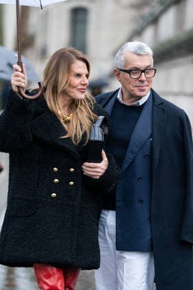PFW - Patou Arrivals Anna Dello Russo (L) wears black Patou fur short coat, red over the knees leather boots, black bag, gold chain necklace, and Giorgio Guidotti (R) wears, white shirt, navy sweater, blue blazer, white pants, black coat, brown boots (R), outside Patou Menswear Fall Winter 2026-2027 show as part of Paris Fashion Week on January 25, 2026 in Paris, France. Photo by LounisPhotography ABACAPRESS.COM Paris France  Copyright: xLounisPhotography ABACAx