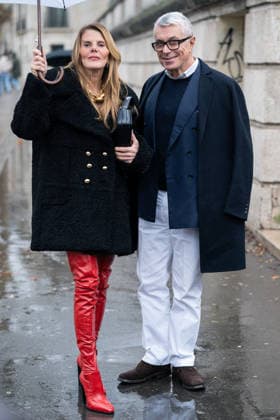 PFW - Patou Arrivals Anna Dello Russo (L) wears black Patou fur short coat, red over the knees leather boots, black bag, gold chain necklace, and Giorgio Guidotti (R) wears, white shirt, navy sweater, blue blazer, white pants, black coat, brown boots (R), outside Patou Menswear Fall Winter 2026-2027 show as part of Paris Fashion Week on January 25, 2026 in Paris, France. Photo by LounisPhotography ABACAPRESS.COM Paris France  Copyright: xLounisPhotography ABACAx