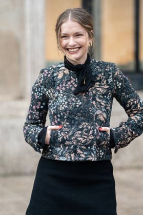 PFW - Patou Arrivals Camille Razat wears colored floral tapestry jacket with a black velvet bow detail, a black mini skirt, outside Patou Menswear Fall Winter 2026-2027 show as part of Paris Fashion Week on January 25, 2026 in Paris, France. Photo by LounisPhotography ABACAPRESS.COM Paris France  Copyright: xLounisPhotography ABACAx