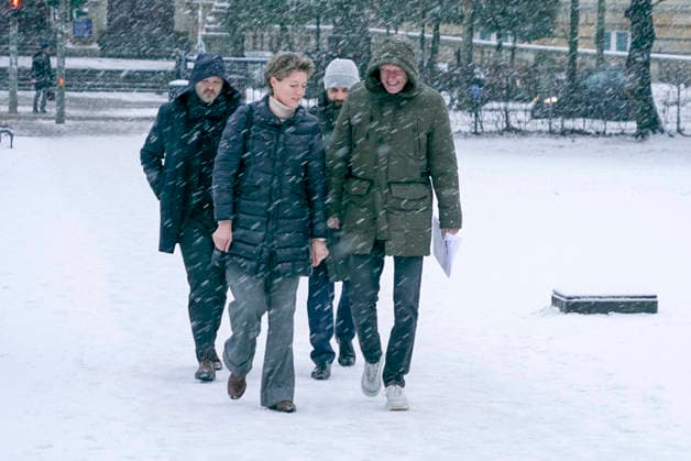 Gerhard Delling TV presenter with lawyer David Rieks Christina Block on foot in the snow on the way to the hearing in the trial for alleged child abduction in the Hamburg District Court Criminal Justice Building Abduction case of the Block children Hamburg Germany