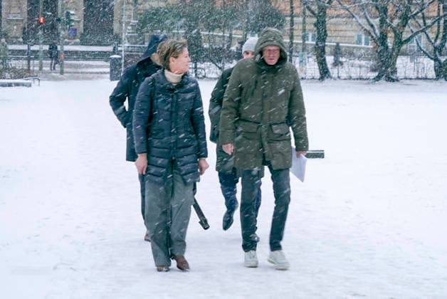 Gerhard Delling TV presenter with lawyer David Rieks Christina Block on foot in the snow on the way to the hearing in the trial for alleged child abduction in the Hamburg District Court Criminal Justice Building Abduction case of the Block children Hamburg Germany