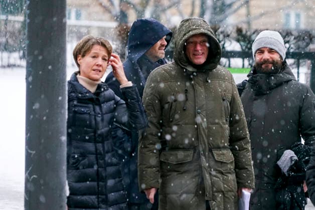Gerhard Delling TV presenter with lawyer David Rieks Christina Block on foot in the snow on the way to the hearing in the trial for alleged child abduction in the Hamburg District Court Criminal Justice Building Abduction case of the Block children Hamburg Germany