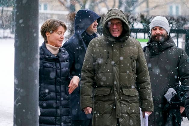 Gerhard Delling TV presenter with lawyer David Rieks Christina Block on foot in the snow on the way to the hearing in the trial for alleged child abduction in the Hamburg District Court Criminal Justice Building Abduction case of the Block children Hamburg Germany