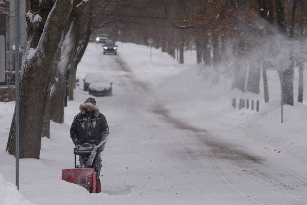 January 26, 2026, Halifax, Ns, Canada: A person clears snow during a winter storm that closed schools and delayed travel in Halifax on Monday, Jan. 26, 2026. Severe cold weather warnings and snowfall warnings have remained in place across Atlantic Canada. Halifax Canada  - ZUMAc35_ 20260126_zaf_c35_003 Copyright: xDarrenxCalabresex
