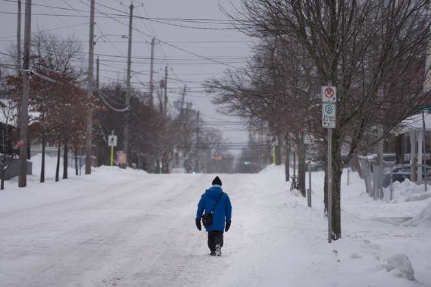 January 26, 2026, Halifax, Ns, Canada: A pedestrian walks down a snow-covered street during a winter storm that closed schools and delayed travel in Halifax on Monday, Jan. 26, 2026. Severe cold weather warnings and snowfall warnings have remained in place across Atlantic Canada. Halifax Canada  - ZUMAc35_ 20260126_zaf_c35_002 Copyright: xDarrenxCalabresex