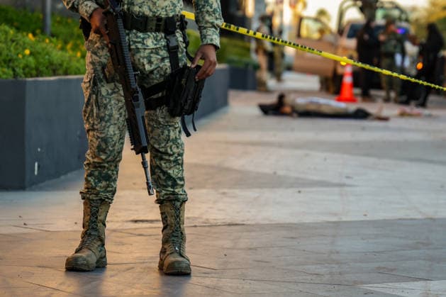 Body found with narco-messages in commercial area of Culiacan in Mexico SINALOA, MEXICO - JANUARY 26: (EDITOR S NOTE: Image depicts death) A man is found dead, tortured, and with the skin removed from his face in front of the Cuatro Rios shopping plaza, located in the main commercial area of Culiacan, as the Mexican Army secures the area until investigations are completed, in Sinaloa, Mexico, on January 26, 2026. Three narco-messages written on banners, along with additional mutilated body parts belonging to the victim, are found next to the body. Jesus Verdugo Anadolu Culiacan Mexico. Editorial use only. Please get in touch for any other usage. Copyright: x2026xAnadoluxJesusxVerdugox
