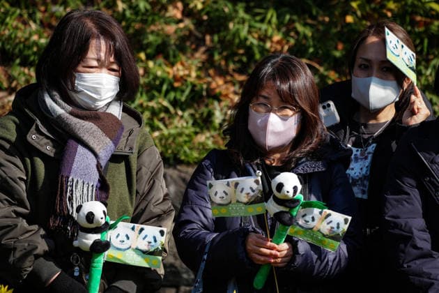 (260127) -- TOKYO, Jan. 27, 2026 -- Local residents wait to bid farewell to the twin giant pandas Xiao Xiao and Lei Lei outside the Ueno Zoological Gardens in Tokyo, Japan, on Jan. 27, 2026. The last remaining two giant pandas in Japan on Tuesday left Tokyo s Ueno zoo for their return to China, marking the first time that there will be no pandas in Japan in around half a century. The twin pandas, Xiao Xiao and Lei Lei, were transported by truck from the Ueno Zoological Gardens to Narita Airport, where they were scheduled to board a flight back to China. Xiao Xiao and Lei Lei were born in 2021 to their mother Shin Shin and her mate, Ri Ri, which were returned to China in September 2024. Their elder sister, celebrity giant panda Xiang
