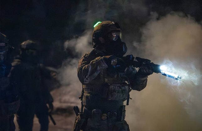 January 26, 2026: Federal agents attempt to push protesters back near the scene of a shooting by a federal agent in north Minneapolis on Jan. 14, 2026. - ZUMAm67_ 20260126_zaf_m67_013 Copyright: xRichardxTsong-Taatariix