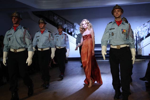 A Model and the Paris Firefighters who are present as Franck Sorbier donates a dress for a childrens auction at the Franck Sorbier, Haute Couture Spring Summer 2026 Collection runway show as part of Paris Fashion Week PFW at the Pavillon Wagram, in Paris, France, January 28, 2026 Bertrand Rindoff Bestimage Runway Franck Sorbier Haute Couture Spring Summer 2026 show as part of Paris Fashion Week on January 28, 2026 in Paris, France Paris France  Copyright: xBERTRANDxRINDOFFxPETROFFx xBESTIMAGExBERTRANDxRINDOFFxPETROFFx xBESTIMAGEx