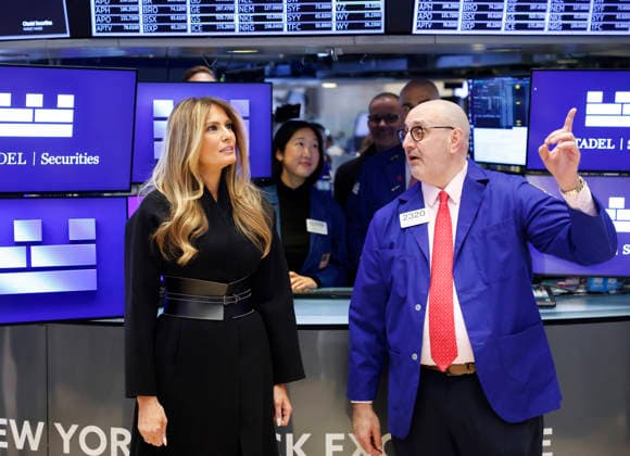 First lady Melania Trump stands with a trader on the floor of the NYSE before ringing the opening bell at the New York Stock Exchange on Wall Street on Wednesday, January 28, 2026 in New York City. The First Lady made the appearance as part of her publicity tour for the film, Melania, which documents her life in the 20 days leading up to President Donald Trump s second inauguration.  NYP202601028118 JOHNxANGELILLO