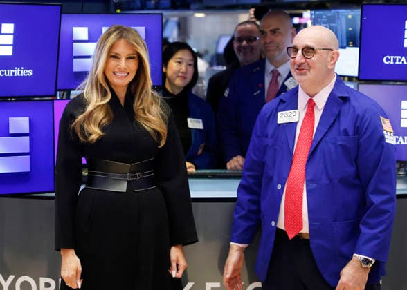 First lady Melania Trump stands with a trader on the floor of the NYSE before ringing the opening bell at the New York Stock Exchange on Wall Street on Wednesday, January 28, 2026 in New York City. The First Lady made the appearance as part of her publicity tour for the film, Melania, which documents her life in the 20 days leading up to President Donald Trump s second inauguration.  NYP202601028119 JOHNxANGELILLO