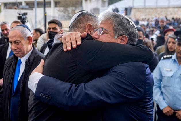Itzik Gvili, the father of Israeli hostage Ran Gvili, whose remains were finally brought back to Israel on January 26, is embraced by Israel s far-right National Security Minister Itamar Ben Gvir, during his son s funeral in the southern town of Meitar, Israel on Wednesday, January 28, 2026. Hundreds of tearful mourners packed a stadium in southern Israel for the funeral of Ran Gvili, the last Gaza hostage whose burial marks the end of a painful national saga triggered by Hamas s 2023 attack. Israeli forces on January 26 brought home the remains of Gvili, who was killed in action and whose body Palestinian militants took into Gaza during their October 7 attack, which triggered a devastating two-year war. Pool  JRX20260128250 CHAIMxGOLDBERG