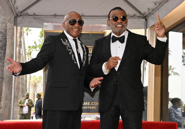 Singer-songwriters Ernie Isley (L) and Ronald Isley of the US band The Isley Brothers gesture during an unveiling ceremony honoring the band with the 2,834th star on the Hollywood Walk of Fame in Los Angeles on Wednesday, January 28, 2026.  LAP2026012806 JIMxRUYMEN