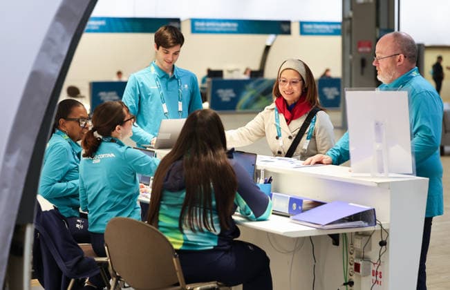 (260129) -- MILAN, Jan. 29, 2026 -- Staffs work at a help desk in the main media center (MMC) of the Milan-Cortina 2026 Olympic Winter Games in Milan, Italy, Jan. 28, 2026. ) (SP)ITALY-MILAN-WINTER OLYMPICS-MAIN MEDIA CENTER DuxXiaoyi 