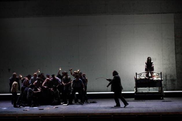 Dmitry Ulyanov center as Boris Timofeyevich Ismailov , Ambur Braid right as Katerina Lvovna Ismailova and Sean Panikkar left with ensemble as Sergei during the photo rehearsal for Lady Macbeth of Mtsensk at the Komische Ope