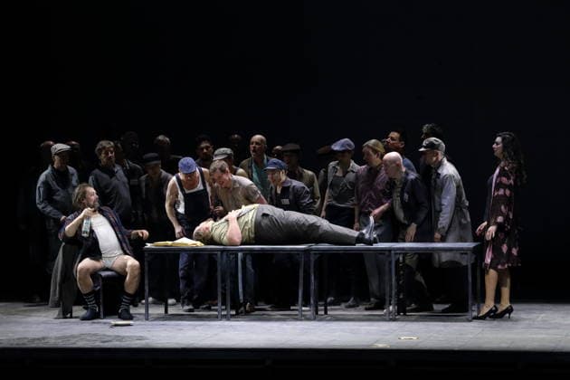 Dimitry Ivashchenko as Pope , Dmitry Ulyanov as Boris Timofeyevich Ismailov and Ambur Braid as Katerina Lvovna Ismailova , front from l , and ensemble during the photo rehearsal for Lady Macbeth of Mtsensk at the Komische Ope