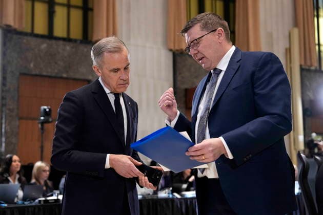 January 29, 2026, Ottawa, On, CAN: Prime Minister Mark Carney and Premier of Saskatchewan Scott Moe speak as they look at a document before a First Ministers Meeting in Ottawa, on Thursday, Jan. 29, 2026. Ottawa CAN  - ZUMAc35_ 20260129_zaf_c35_018 Copyright: xJustinxTangx
