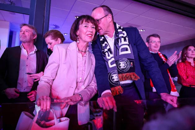 01 02 2026, Handball, Men s EHF EURO 2026, Germany Denmark, Jyske Bank Boxing in Herning, Final The German Chancellor Friedrich Merz Chancellor Politician CDU follows the game with a fan scarf around his neck together with his wife Charlotte Merz left Denmark