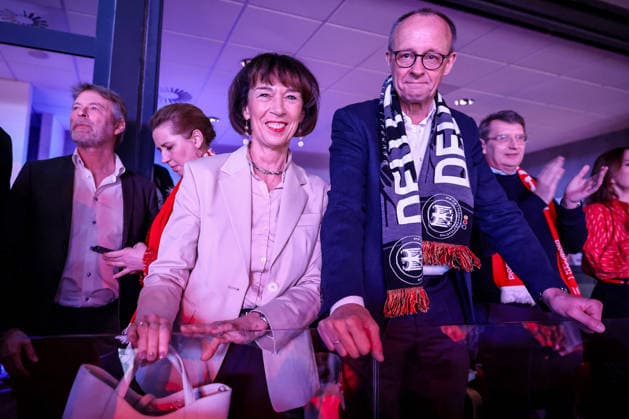 01 02 2026, Handball, Men s EHF EURO 2026, Germany Denmark, Jyske Bank Boxing in Herning, Final The German Chancellor Friedrich Merz Chancellor Politician CDU follows the game with a fan scarf around his neck together with his wife Charlotte Merz left Denmark