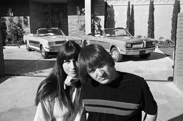 RECORD DATE NOT STATED Sonny and Cher Bono with their identical Ford Mustangs, designed and built by George Barris, in front of their home in the Encino Hills of California 1967 EDITORIAL USE ONLY  Copyright: xMarvxNewtonx