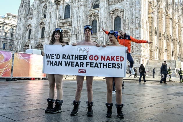 PETA protests We d Rather go naked than wear feathers! before the Olympics. February 5, 2026, Milan. Piazza Duomo. Better Naked Than Wear Feathers, PETA s protest before the Olympics. A trio of nearly naked PETA supporters wearing only hats, ski goggles, and snow boots stand behind a banner reading We d Rather Go Naked Than Wear Feathers! , Credit:Nicola Marfisi Avalon Italy, MI, Milan  Copyright: xNicolaxMarfisix xAvalonx 1072326582