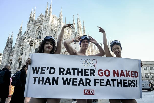 PETA protests We d Rather go naked than wear feathers! before the Olympics. February 5, 2026, Milan. Piazza Duomo. Better Naked Than Wear Feathers, PETA s protest before the Olympics. A trio of nearly naked PETA supporters wearing only hats, ski goggles, and snow boots stand behind a banner reading We d Rather Go Naked Than Wear Feathers! , Credit:Nicola Marfisi Avalon Italy, MI, Milan  Copyright: xNicolaxMarfisix xAvalonx 1072326717