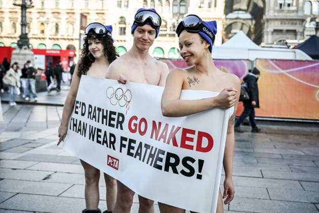 PETA protests We d Rather go naked than wear feathers! before the Olympics. February 5, 2026, Milan. Piazza Duomo. Better Naked Than Wear Feathers, PETA s protest before the Olympics. A trio of nearly naked PETA supporters wearing only hats, ski goggles, and snow boots stand behind a banner reading We d Rather Go Naked Than Wear Feathers! , Credit:Nicola Marfisi Avalon Italy, MI, Milan  Copyright: xNicolaxMarfisix xAvalonx 1072326732