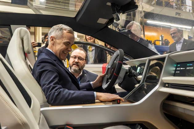 February 5, 2026, Woodbridge, Ontario, CANADA: Automotive Parts ManufacturersöÄÃ Association President Flavio Volpe shows Prime Minister Mark Carney, front, the Project Arrow 2.0 prototype vehicle during a tour of an auto-parts plant, Woodbridge, Ont., February 5, 2026. Woodbridge CANADA - ZUMAc35_ 20260205_zaf_c35_059 Copyright: xEduardoxLimax