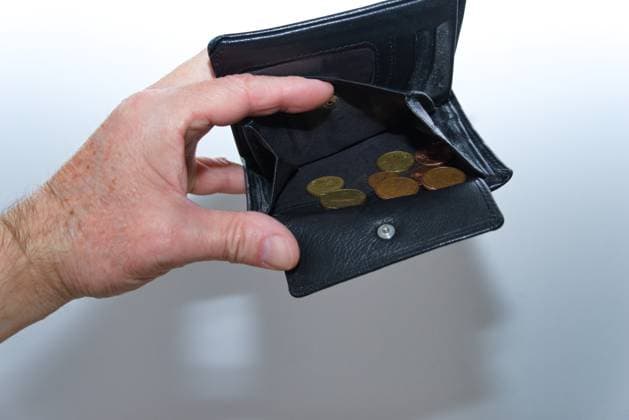 Hand holds almost Empty Wallet at Symbol image for Lack of money 1077406550