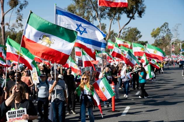 February 7, 2026, Claremont, California, Claremont: Protesters march down Culver Drive during a Freedom for Iran rally at William R. Mason Regional Park in Irvine, California. Claremont Claremont  - ZUMAk198 20260207_zsp_k198_002 Copyright: xGhawamxKouchakix