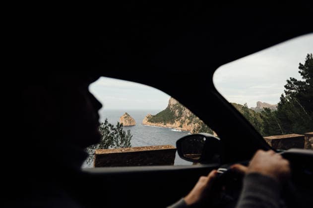Man Driving MA-2210 With Coastal View to Cap de Formentor, Mallorca Port de Pollença, Balearic Islands, Spain R_EPZT260206B-1946584-01 ,model released, Symbolfoto