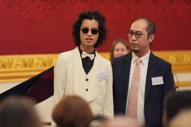 Queen Camilla hosts The Amber Trust reception Chapman Shum (left) from the The Amber Trust after performing in front of Queen Camilla during a reception to celebrate 30 years of The Amber Trust, which provides musical opportunities for blind and partially sighted children, including children with more complex needs, at St James Palace, London. Picture date: Tuesday February 10, 2026., Credit:Yui Mok Avalon UK, London  Copyright: xYuixMokx xAvalonx 1073948956