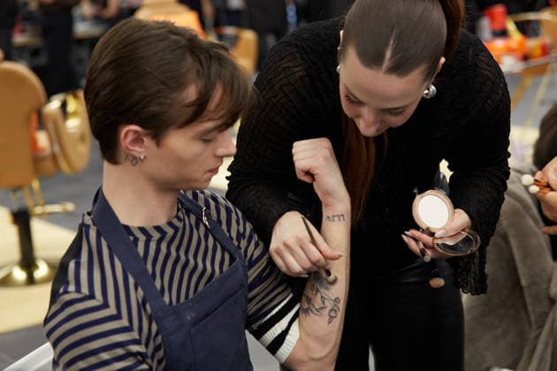 February 11, 2026, New York, New York, USA: Model prepares backstage ahead of the MenÃ¢â‚¬â ¢s Day FW26 presentations during New York Fashion Week in New York City. New York USA  - ZUMAs237 20260211_aap_s237_004 Copyright: xMarkxJ.xSullivanx