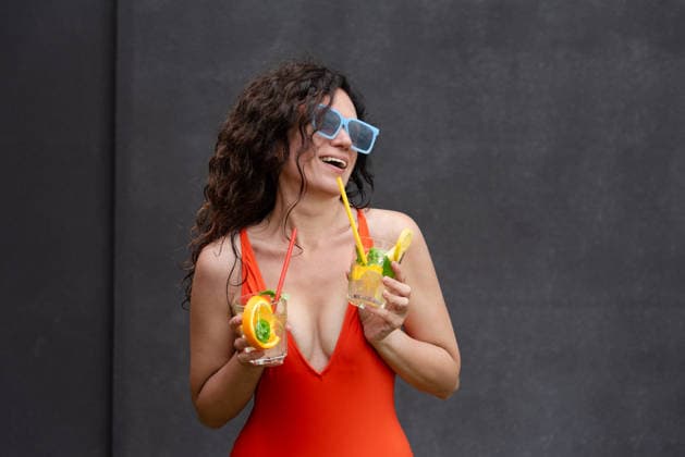 Happy woman in red swimsuit with cocktails on a vacation Truskavets, Lviv Oblast, Ukraine R_YEPI260206-1960330-01 ,model released, Symbolfoto