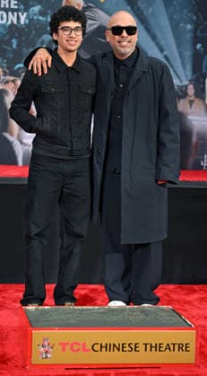 Jo Koy (R) and his son Joseph Herbert Jr. attend a hand and footprint ceremony honoring Koy in the forecourt of the TCL Chinese Theatre in Los Angeles, California on Wednesday, February 11, 2026.  LAP20260211718 CHRISxCHEW