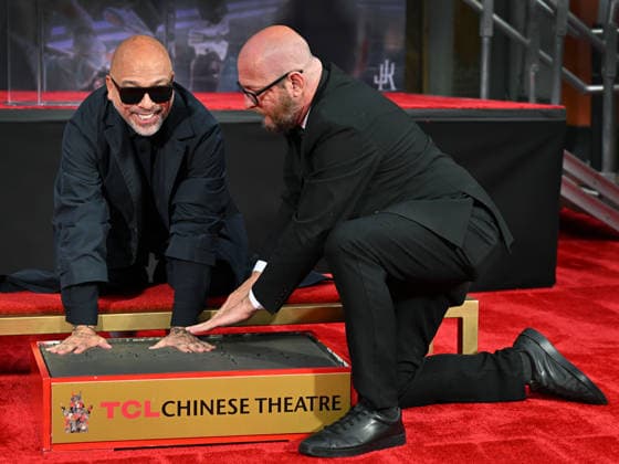 Comedian and actor Jo Koy (L) is honored with a hand and footprint ceremony in the forecourt of the TCL Chinese Theatre in Los Angeles, California on Wednesday, February 11, 2026.  LAP20260211727 CHRISxCHEW