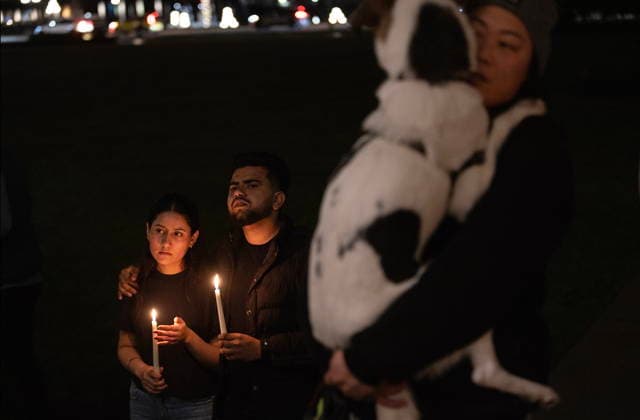 February 11, 2026, Victoria, Bc, CAN: Navjot Kaur, left, joins her partner Arjun Chahal as they attend a candle light vigil at the front steps of the legislature in Victoria, B.C., on Wednesday, Feb. 11, 2026 in honour of the victims of the school shooting in Tumbler Ridge, B.C. Victoria CAN  - ZUMAc35_ 20260211_zaf_c35_324 Copyright: xChadxHipolitox