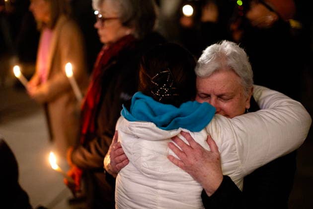 February 11, 2026, Victoria, Bc, CAN: People console one another during a candle light vigil at the front steps of the legislature in Victoria, B.C., on Wednesday, Feb. 11, 2026 in honour of the victims of the school shooting in Tumbler Ridge, B.C. Victoria CAN  - ZUMAc35_ 20260211_zaf_c35_327 Copyright: xChadxHipolitox