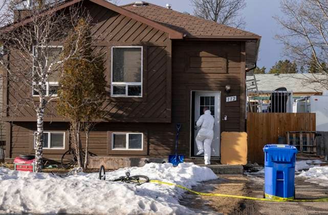 February 12, 2026, Tumbler Ridge, Bc, CANADA: A police investigator enters the home where two bodies were found in Tumbler Ridge, B.C., on Thursday, Feb. 12, 2026. Tumbler Ridge CANADA  - ZUMAc35_ 20260212_zaf_c35_194 Copyright: xChristinnexMuschix