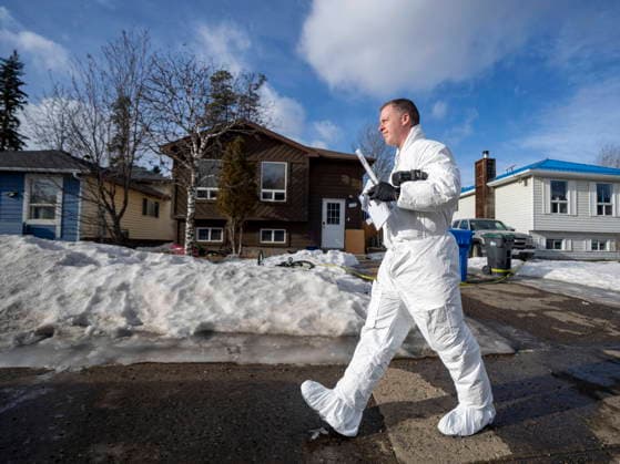 February 12, 2026, Tumbler Ridge, Bc, CANADA: A police investigator leaves the home where two bodies were found in Tumbler Ridge, B.C., on Thursday, Feb. 12, 2026. Tumbler Ridge CANADA  - ZUMAc35_ 20260212_zaf_c35_306 Copyright: xChristinnexMuschix