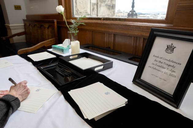 February 12, 2026, Victoria, Bc, CAN: A woman signs a book of condolences in honour of the victims of the Tumbler Ridge, B.C., tragedy as the province declares the day as a day of mourning at the legislature in Victoria, on Thursday, Feb. 12, 2026. Victoria CAN  - ZUMAc35_ 20260212_zaf_c35_308 Copyright: xChadxHipolitox