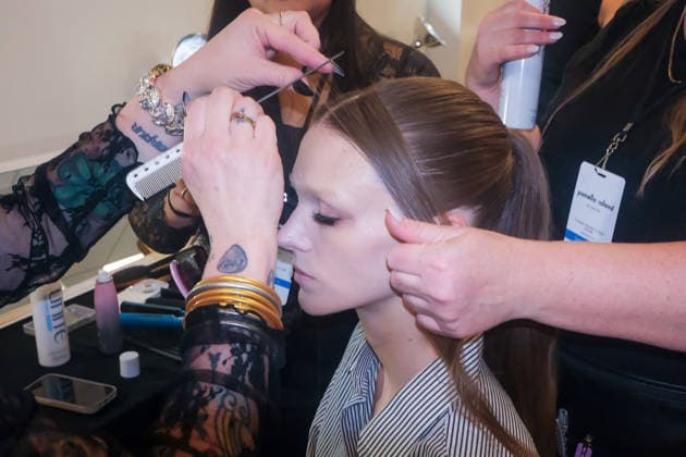 Pamella Roland fashion show during the New York Fashion Week in New York, USA - 12 Feb 2026 A model gets hair and makeup done backstage at the Pamella Roland fashion show during the New York Fashion Week at the New York Public Library. New York United States Copyright: xRonxAdarx xSOPAxImagesx _radar_roland_20260212_0114