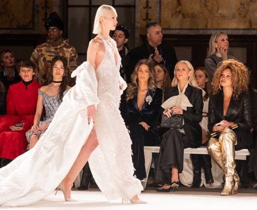 NY: Pamella Roland Fashion Show Fall 2026 Erin Lichy, Nicky Hilton Rothschild, and Jillian Hervey watch as model walks runway for Pamella Roland Fall 2026 show during FW26 Fashion Week at New York Public Library in New York, NY on February 12, 2026. New York New York United States Copyright: LevxRadin