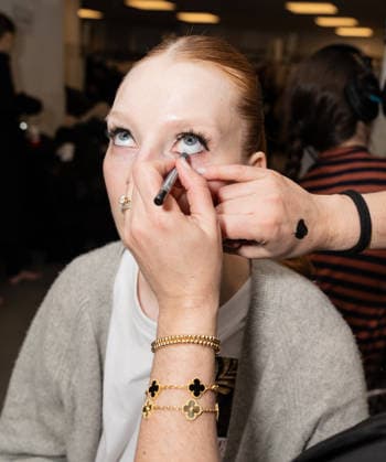 NY: Pamella Roland Fashion Show Fall 2026 Model prepares backstage for Pamella Roland Fall 2026 show during FW26 Fashion Week at New York Public Library in New York, NY on February 12, 2026. New York New York United States Copyright: LevxRadin
