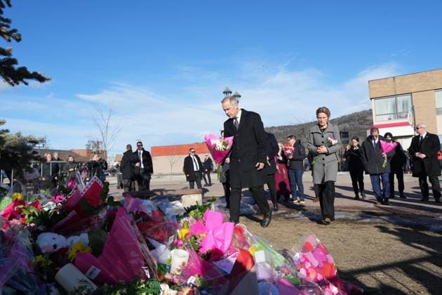 February 13, 2026, Tumbler Ridge, Bc, CANADA: Prime Minister Mark Carney and his wife Diana Fox Carney place flowers at a memorial for the victims of a mass shooting, in Tumbler Ridge, B.C., Friday, Feb. 13, 2026. Tumbler Ridge CANADA  - ZUMAc35_ 20260213_zaf_c35_094 Copyright: xChristinnexMuschix