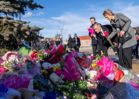 February 13, 2026, Tumbler Ridge, Bc, CANADA: Prime Minister Mark Carney, centre, his wife Diana Fox Carney and Conservative Leader Pierre Poilievre, left, place flowers at a memorial for the victims of a mass shooting, in Tumbler Ridge, B.C., Friday, Feb. 13, 2026. Tumbler Ridge CANADA - ZUMAc35_ 20260213_zaf_c35_141 Copyright: xChristinnexMuschix