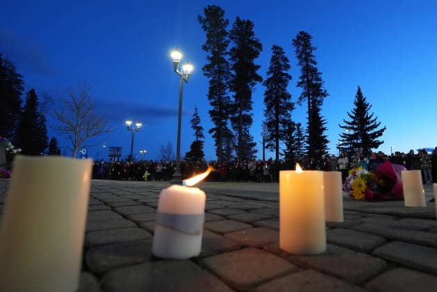 February 13, 2026, Tumbler Ridge, Bc, CANADA: Candles sit on the ground as people attend a vigil for the victims of a mass shooting, in Tumbler Ridge, B.C., Friday, Feb. 13, 2026. Tumbler Ridge CANADA  - ZUMAc35_ 20260213_zaf_c35_181 Copyright: xChristinnexMuschix